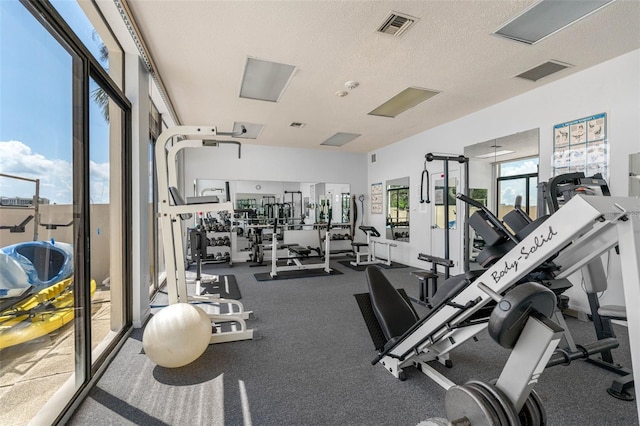 workout area featuring a textured ceiling