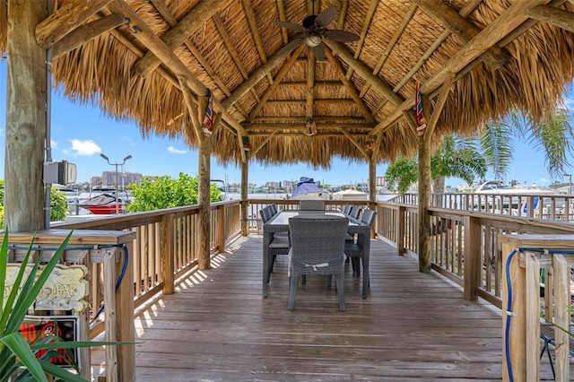 wooden deck featuring ceiling fan and a gazebo