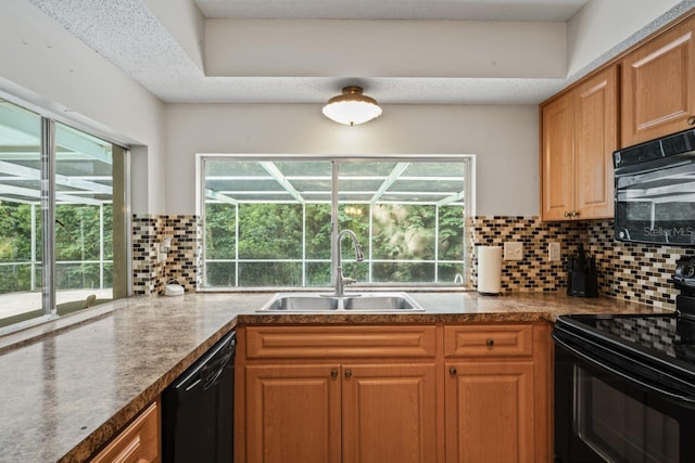 kitchen with black appliances, sink, backsplash, and a healthy amount of sunlight