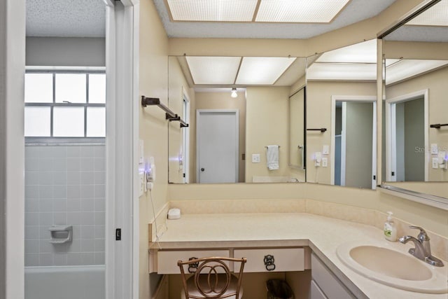 bathroom with vanity and bathtub / shower combination