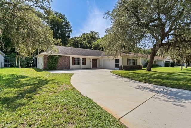 ranch-style home with a garage and a front yard