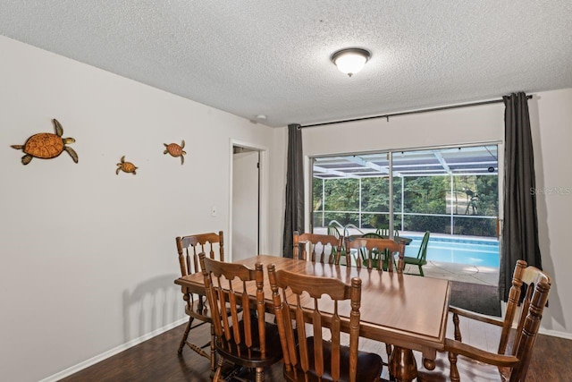 12912 Willoughby Ln, Hudson, FL 34667 - dining space with baseboards, a textured ceiling, a sunroom, and dark wood-style floors