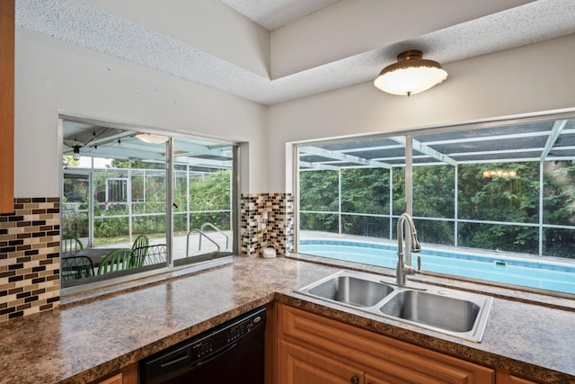 12912 Willoughby Ln, Hudson, FL 34667 - kitchen with a sink, backsplash, black dishwasher, and a sunroom