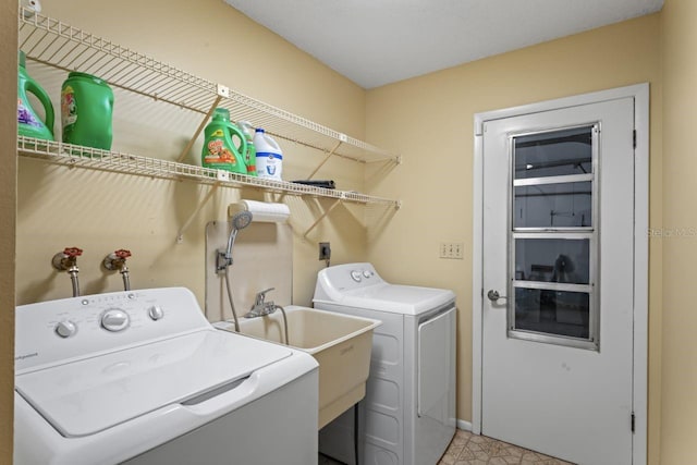 12912 Willoughby Ln, Hudson, FL 34667 - laundry area with washer and dryer, laundry area, and baseboards