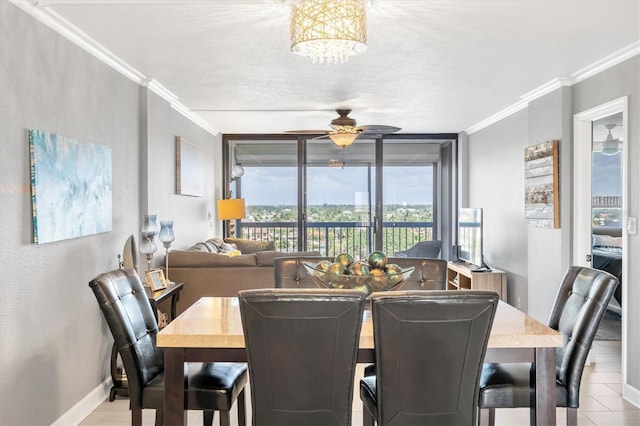 dining space with crown molding, ceiling fan with notable chandelier, and a textured ceiling