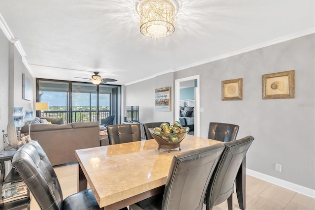 dining area featuring crown molding and ceiling fan