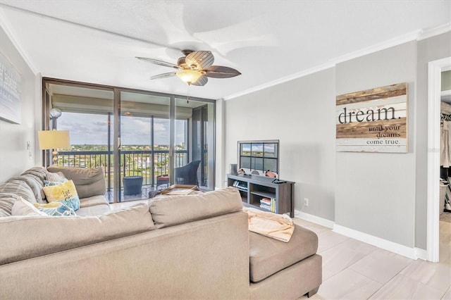 living room featuring expansive windows, ceiling fan, and crown molding