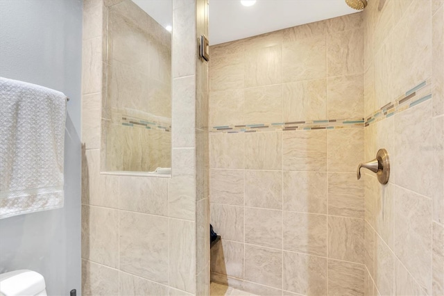 bathroom with tiled shower