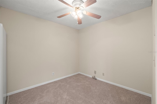 empty room featuring carpet flooring, ceiling fan, and a textured ceiling