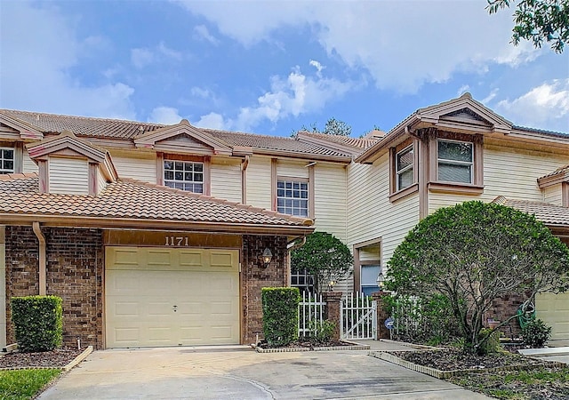 multi unit property featuring a garage