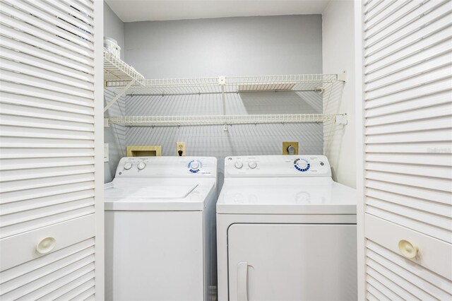 laundry room featuring separate washer and dryer