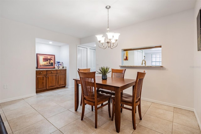 tiled dining area with a notable chandelier