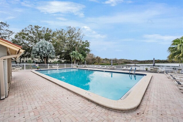 view of swimming pool with a patio area