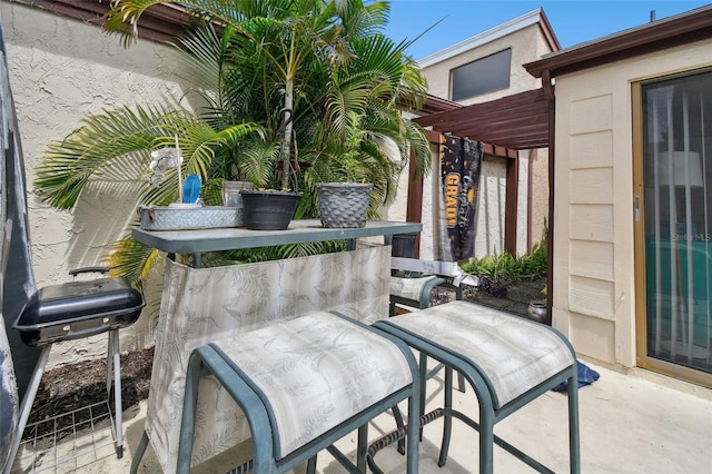 view of patio with a pergola and a grill