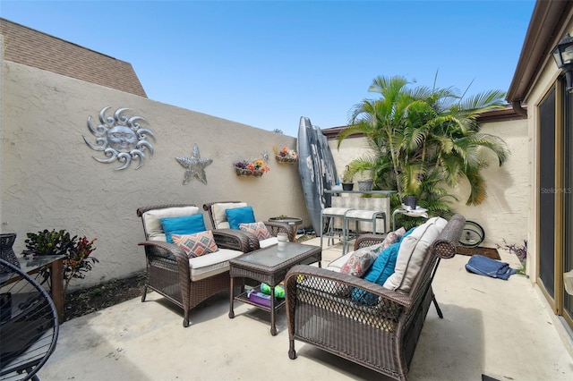 view of patio / terrace with an outdoor living space and an outdoor bar