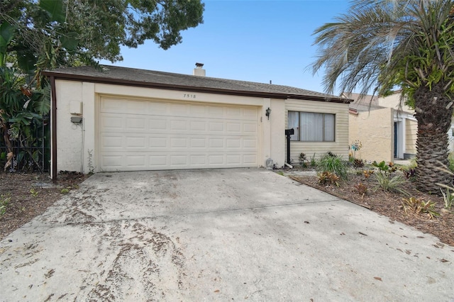 single story home featuring a garage