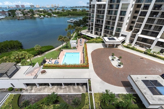 view of swimming pool with a water view