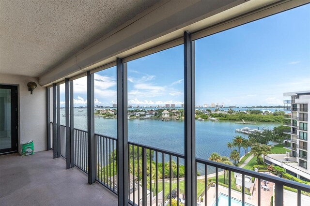 balcony featuring a water view