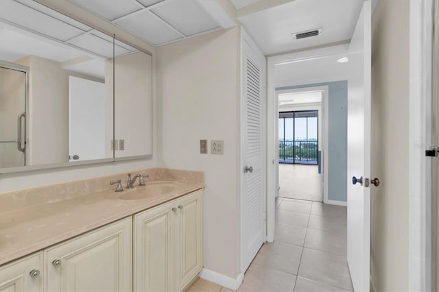 bathroom with vanity and tile patterned flooring