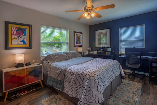 bedroom featuring dark wood-type flooring and ceiling fan