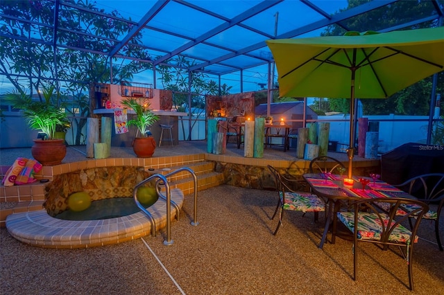 view of patio terrace at dusk