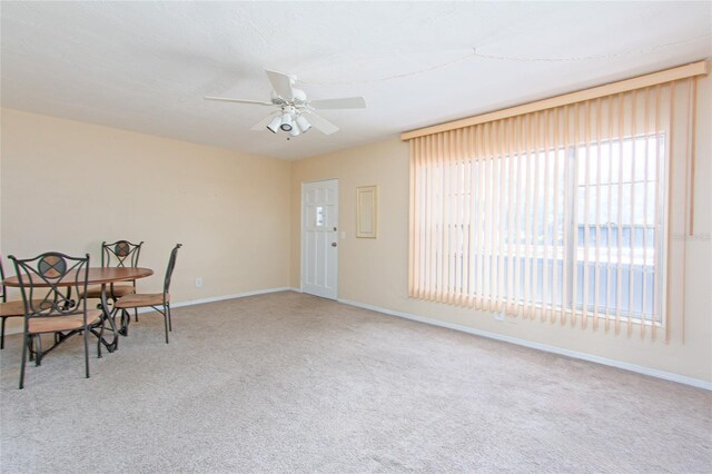 dining area featuring carpet floors and ceiling fan