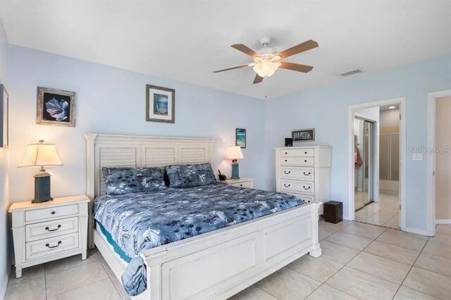 tiled bedroom with ceiling fan