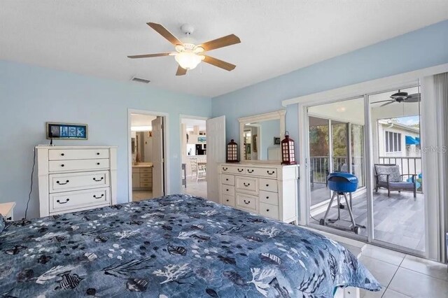 bedroom featuring light tile patterned floors, access to exterior, ceiling fan, and ensuite bath