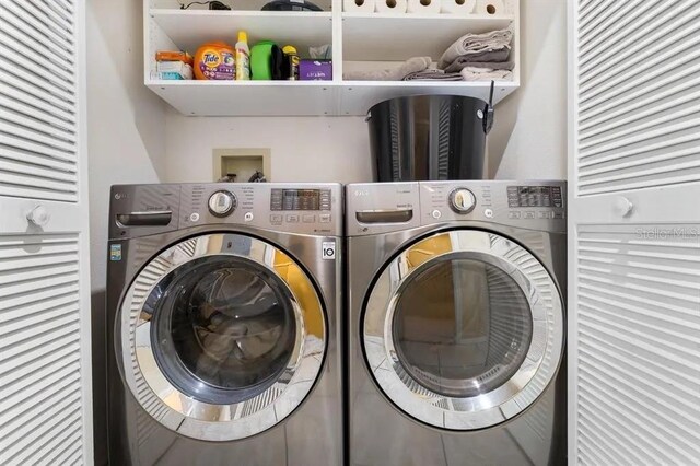 washroom featuring independent washer and dryer