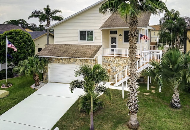 view of front facade featuring a garage and a front lawn