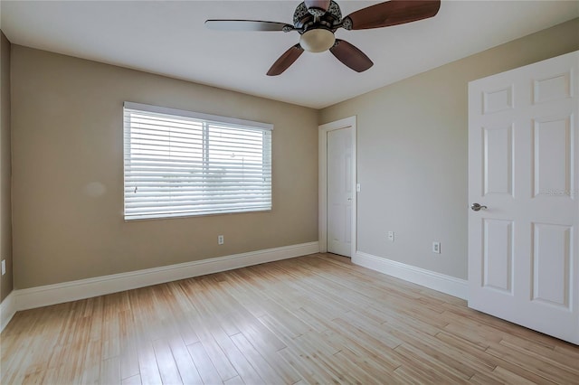 spare room featuring ceiling fan and light wood-type flooring