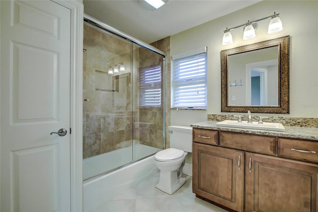 full bathroom featuring vanity, toilet, enclosed tub / shower combo, and tile patterned flooring