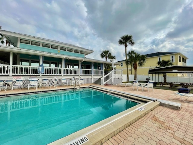 view of swimming pool with a patio