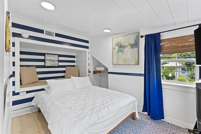 bedroom with light wood-type flooring