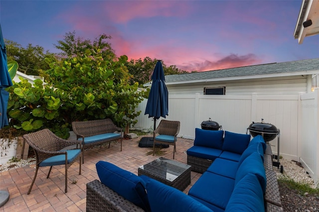 patio terrace at dusk with an outdoor living space