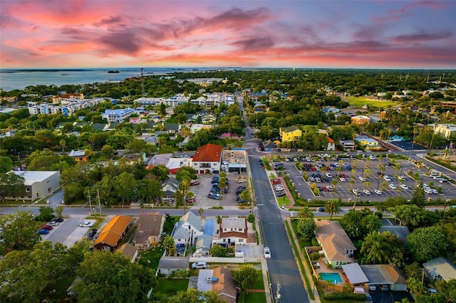 aerial view at dusk with a water view