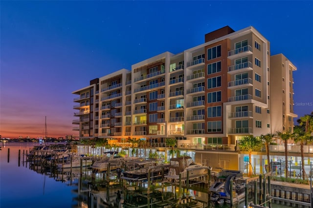 outdoor building at dusk featuring a water view