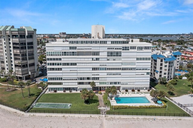 view of property featuring a community pool and a city view