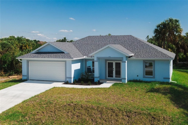 ranch-style home featuring a garage and a front yard