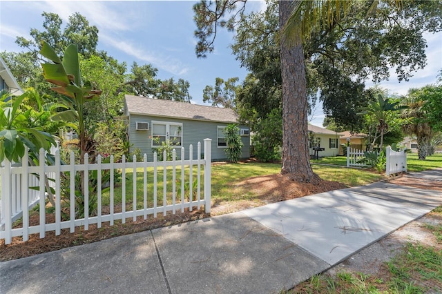 view of front of house featuring a fenced front yard and a front yard