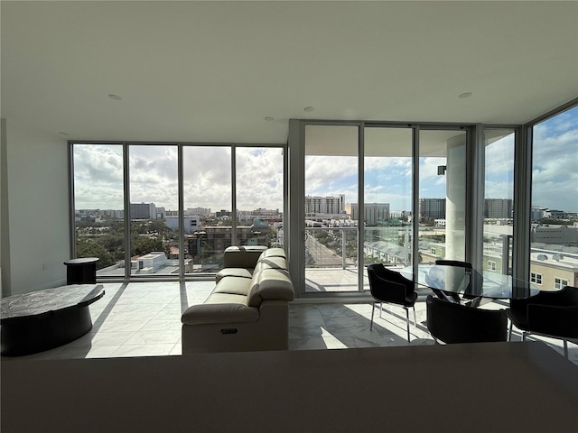 living room featuring a wall of windows