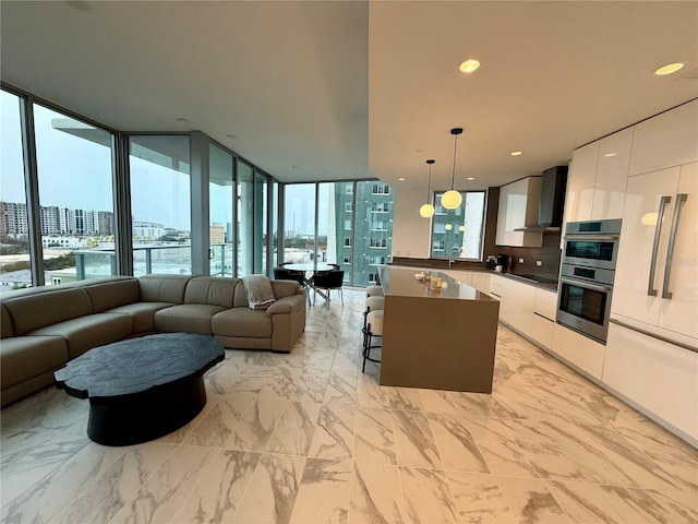 kitchen featuring a view of city, dark countertops, open floor plan, white cabinets, and modern cabinets