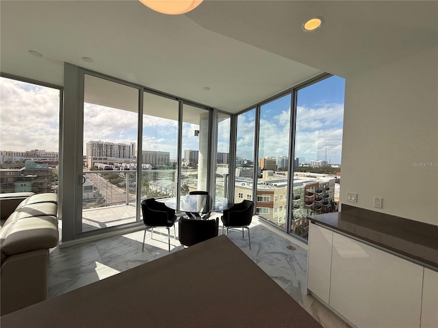 unfurnished sunroom featuring a city view