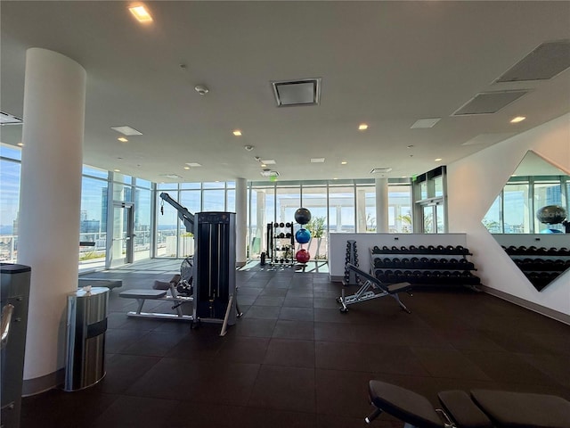 exercise room with floor to ceiling windows