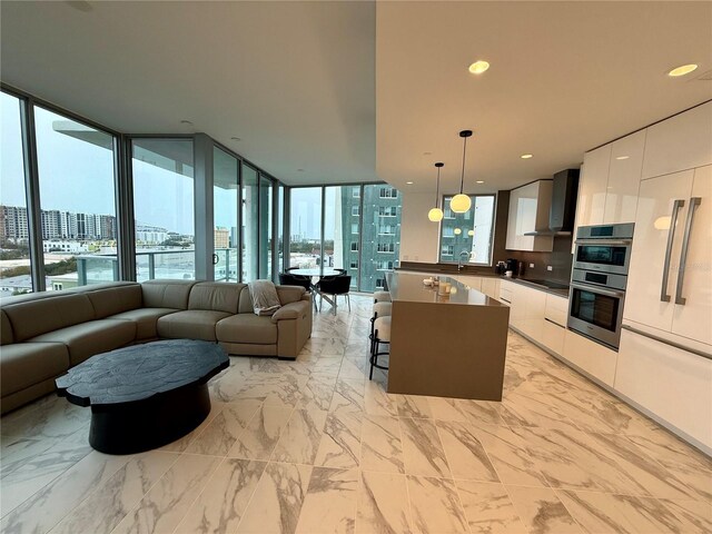 777 3rd Ave N Unit 908, Saint Petersburg, FL 33701 - living area with a city view and light marble finish floors