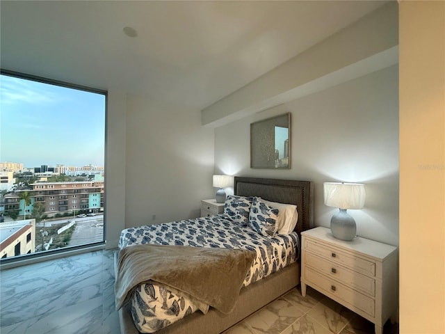 777 3rd Ave N Unit 908, Saint Petersburg, FL 33701 - bedroom with light marble finish floors, expansive windows, and a view of city