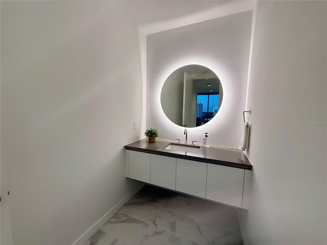 777 3rd Ave N Unit 908, Saint Petersburg, FL 33701 - bathroom with marble look tile flooring, baseboards, and vanity