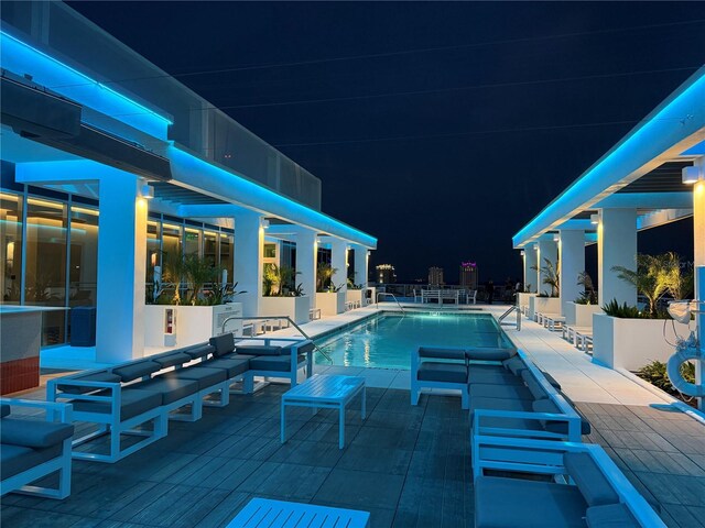 777 3rd Ave N Unit 908, Saint Petersburg, FL 33701 - pool at twilight featuring a patio and a community pool