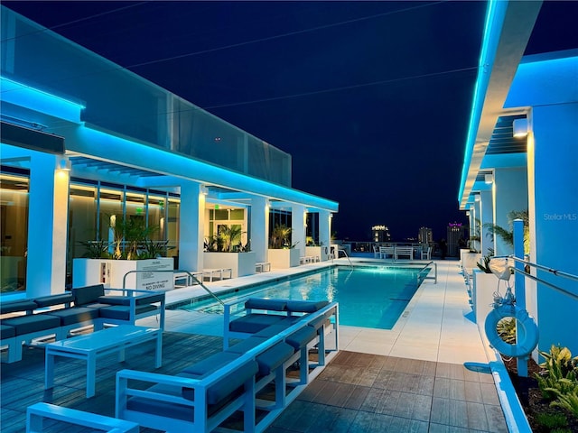 777 3rd Ave N Unit 908, Saint Petersburg, FL 33701 - pool at twilight with a community pool and a patio