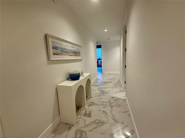 777 3rd Ave N Unit 908, Saint Petersburg, FL 33701 - corridor featuring light marble finish floors, baseboards, and recessed lighting